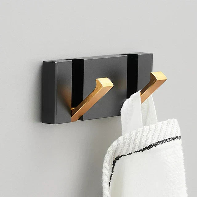 Practical foldable wall hook for kitchen storage, organizing tea towels & utensils, compact.
