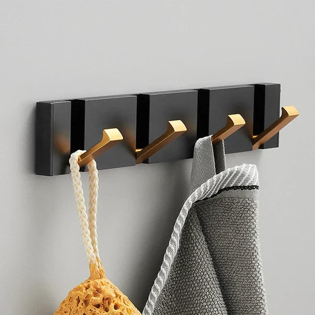 Folded wall hook, discreetly tucked away, ready for space-saving home organization.
