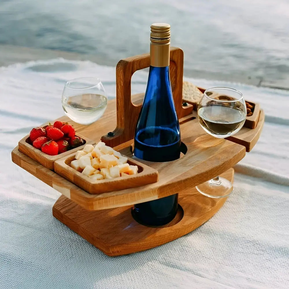 Foldable wooden picnic table with wine bottle & glass holders, snack compartments for outdoor dining.