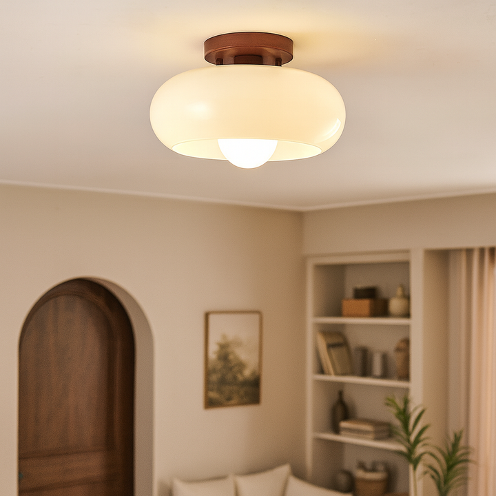 French Bauhaus ceiling lamp featuring elegant wooden detail and warm, atmospheric opal glass light.