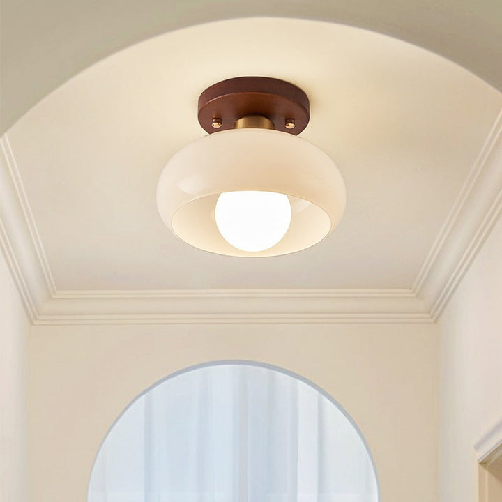 Modern French Bauhaus ceiling lamp with stylish wooden accent and soft, warm glow for contemporary homes.