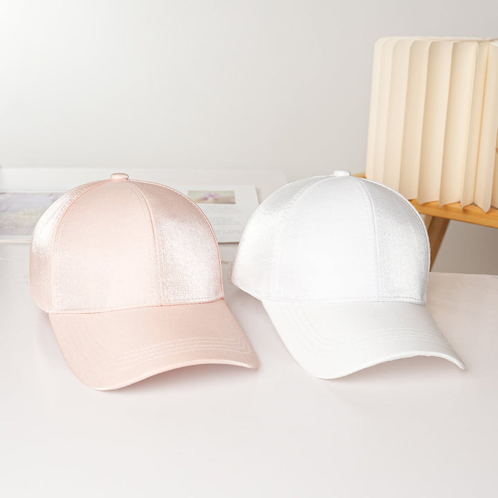 Detailed view of the texture and stitching on a Women's Sporty Satin Baseball Cap, a durable fashion accessory.