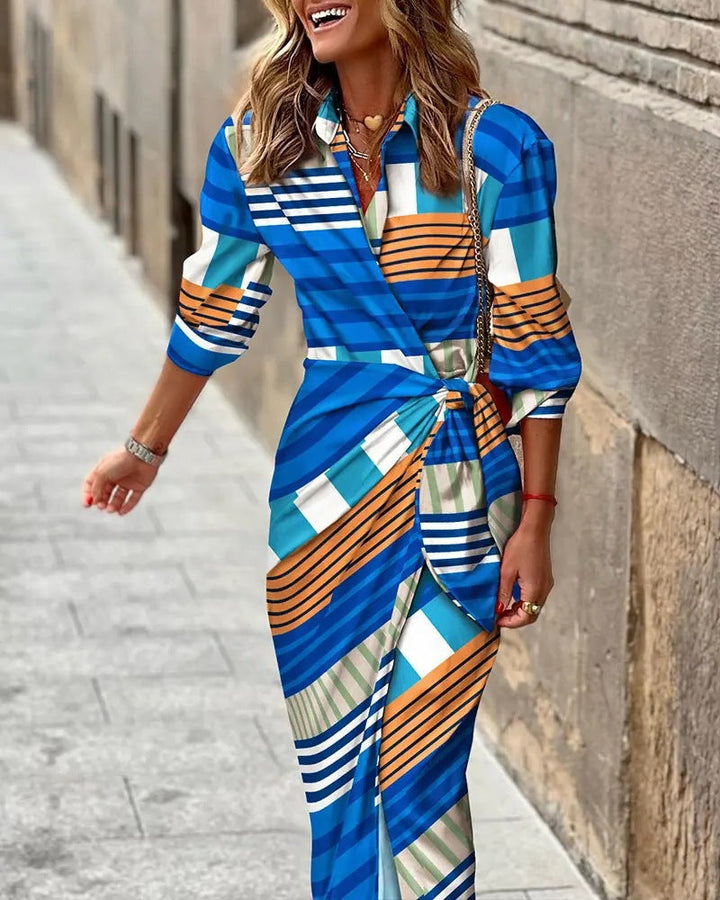 Adjustable women's summer wrap dress, offering a personalized fit. This collared midi is both casual & elegant.