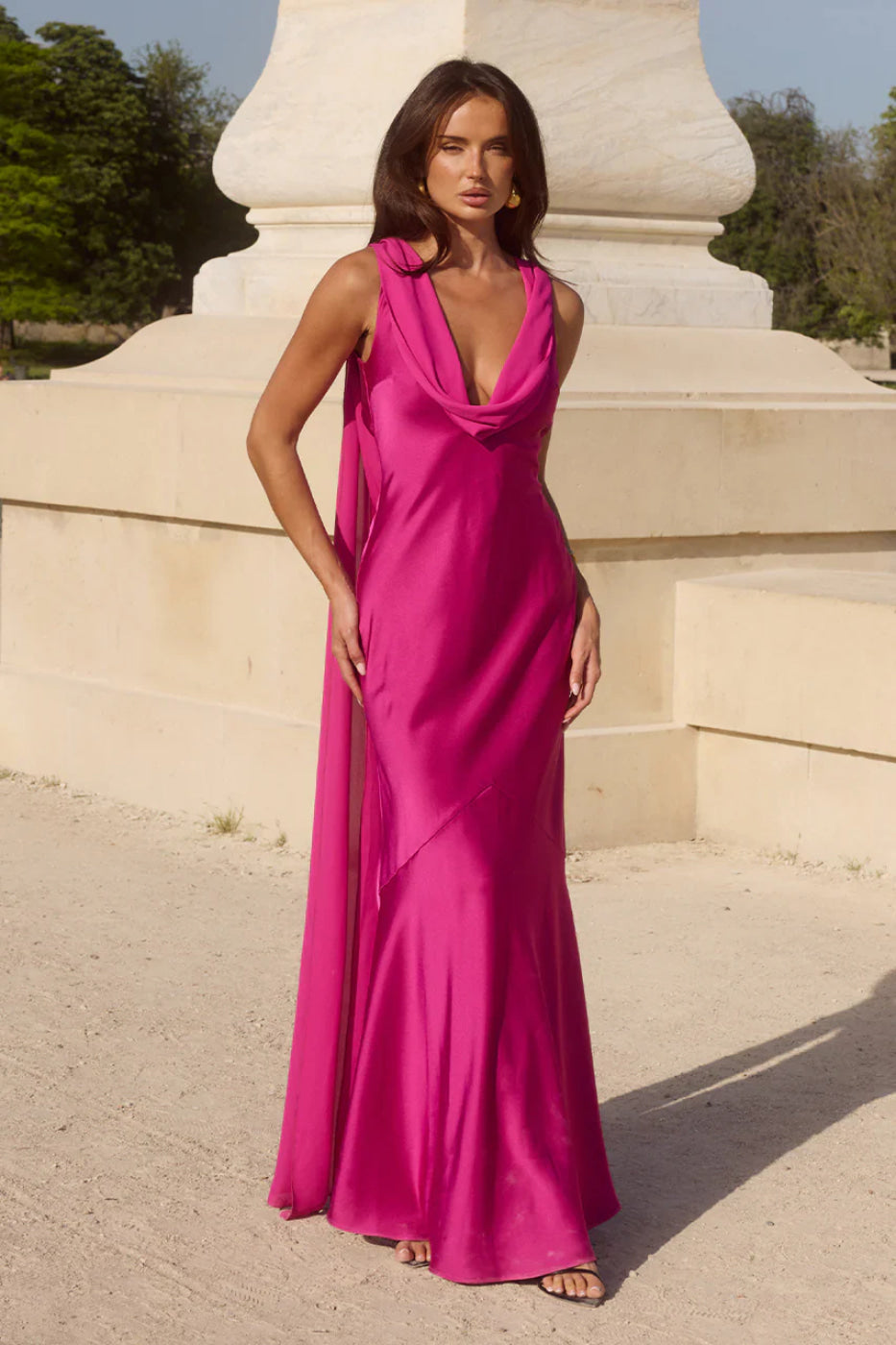 Elegant fuchsia cowl neck maxi dress with a sophisticated open back. Ideal formal evening gown for women.