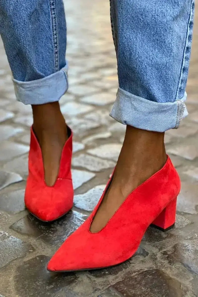 Stylish red block heel pumps for women, featuring a pointed toe and deep cut; ideal for work or evening wear.