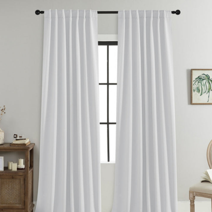 Black thermal blackout curtains for living room, providing darkness, soundproofing, and a cozy atmosphere.