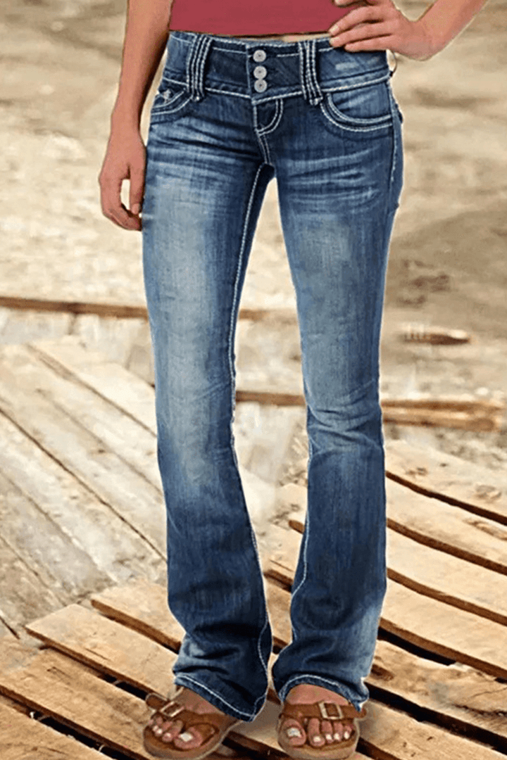 Close-up of the ripped details on trendy Women's High-Waisted Bootcut Jeans, a stylish bottom.
