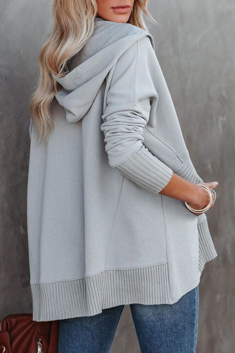 Detail of the comfortable hooded neckline and drawstring on a women's longline tunic sweatshirt.