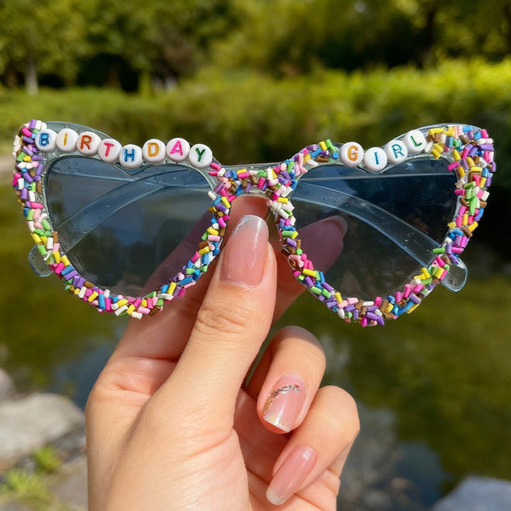 Vibrant heart-shaped birthday glasses for women, offering UV protection. Fun party accessory for any festive event.