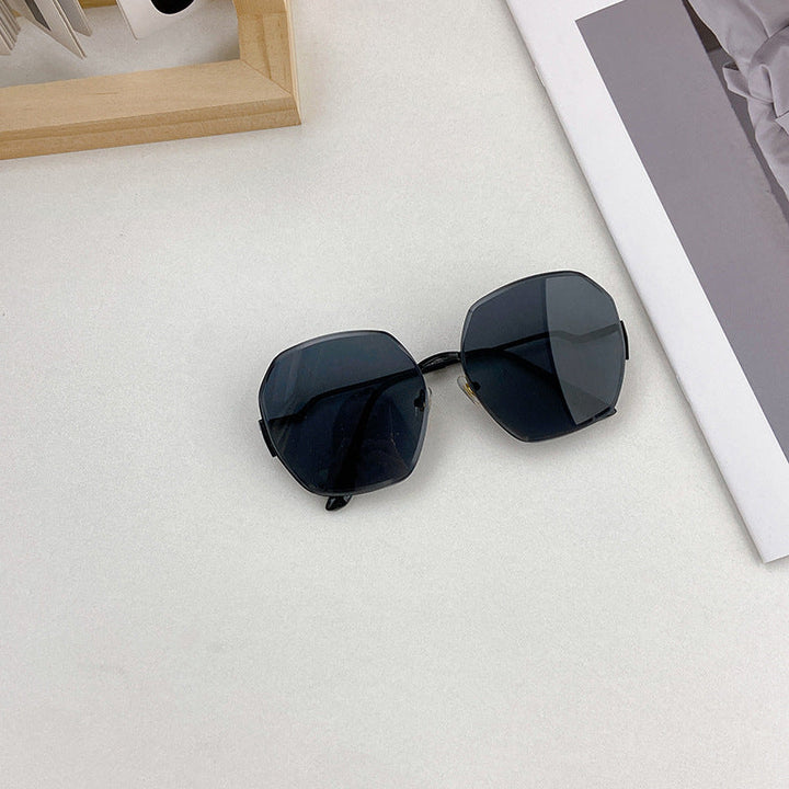 Trendy geometric fashion sunglasses featuring a unique shape and UV 400 eye protection for men & women.