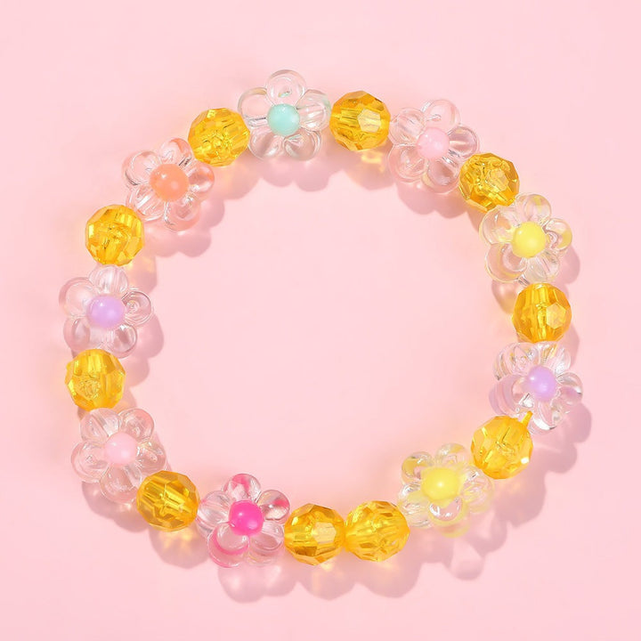 Cheerful girls' friendship bracelet, adorned with colorful flower motifs and shiny beads.
