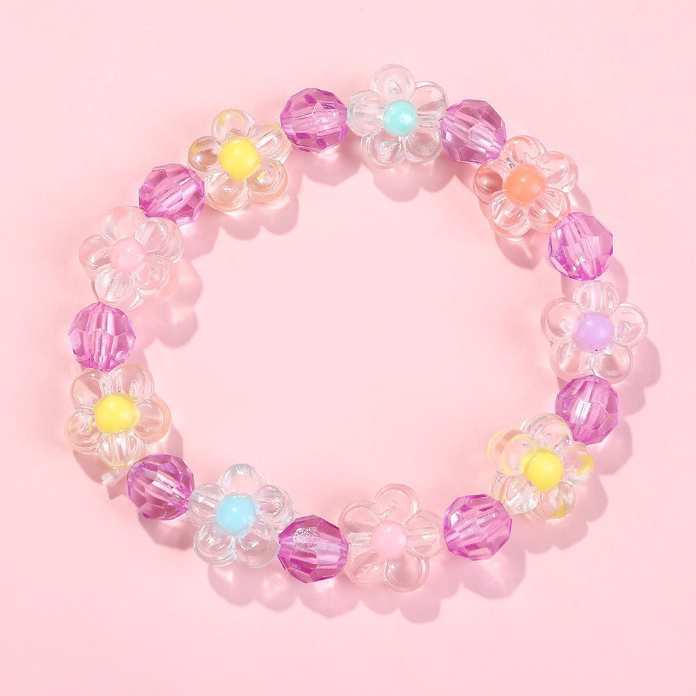 Adjustable friendship bracelet, colorful with charming flower motifs, a vibrant accessory.