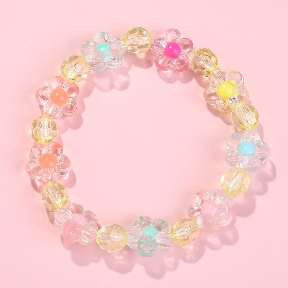 Elastic girls' bracelet with intricate flower motifs and a playful, colorful design.
