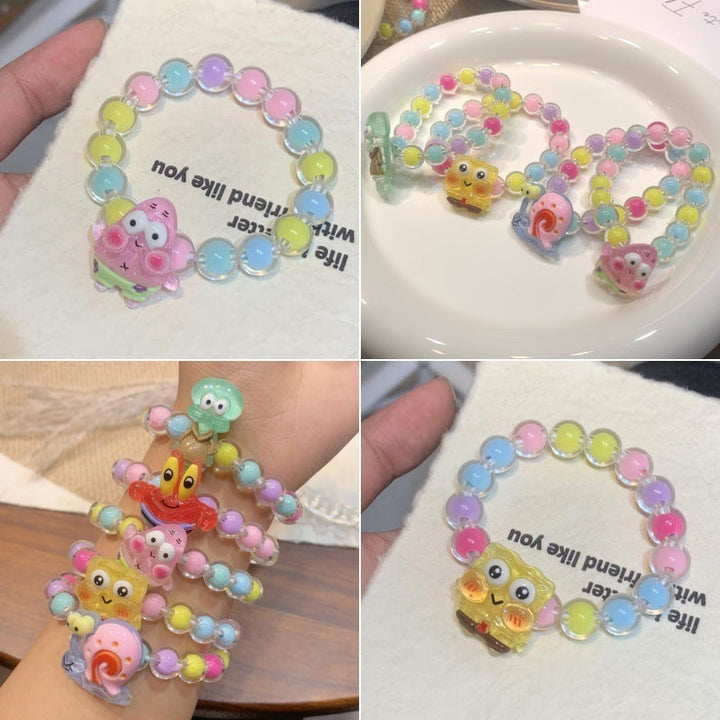 Cheerful girls' elastic bracelet with vibrant cartoon character pendants, fun plastic kids' jewelry.
