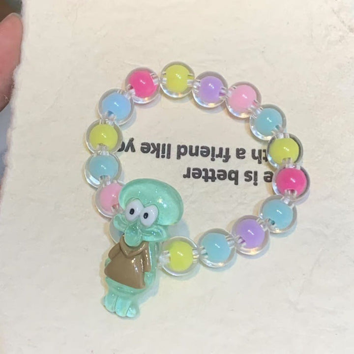 Fun and colorful plastic bracelet for girls, featuring cheerful cartoon character pendants and elastic design.