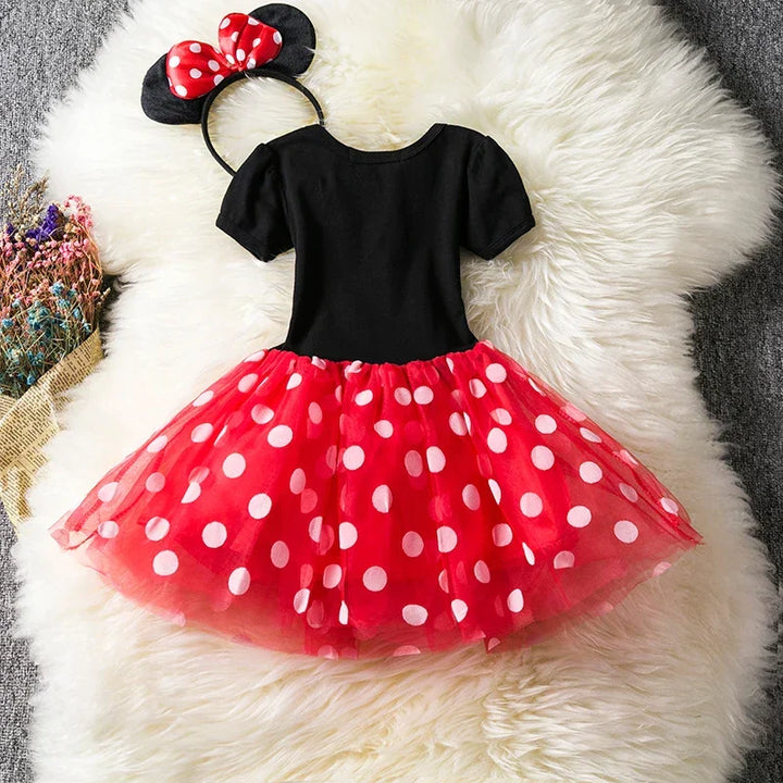 Adorable girls' Minnie Mouse character costume featuring a red polkadot dress and a matching bow headband.