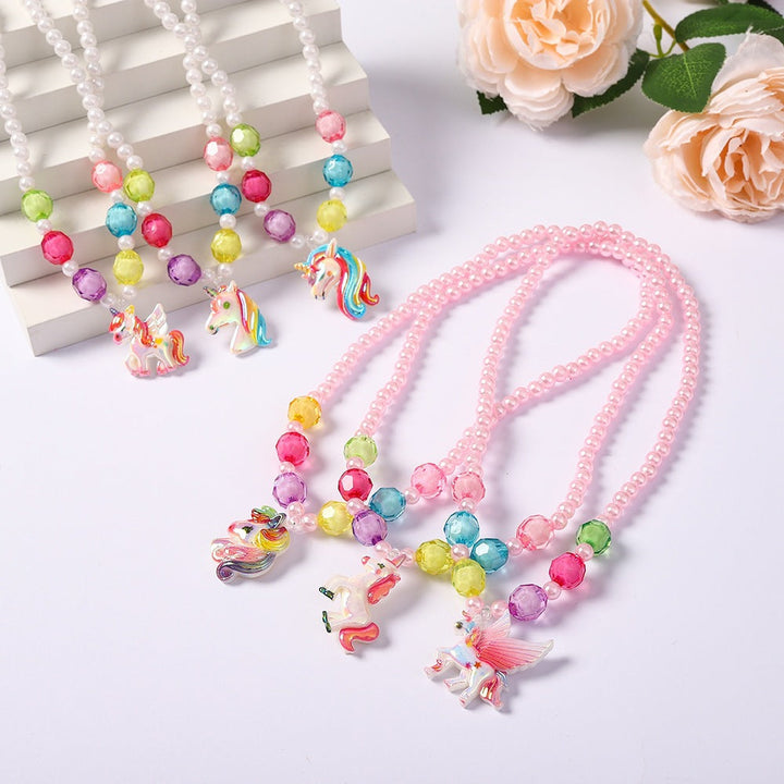 Girls' unicorn charm jewelry set with a rainbow necklace and matching bracelet, perfect for kids.
