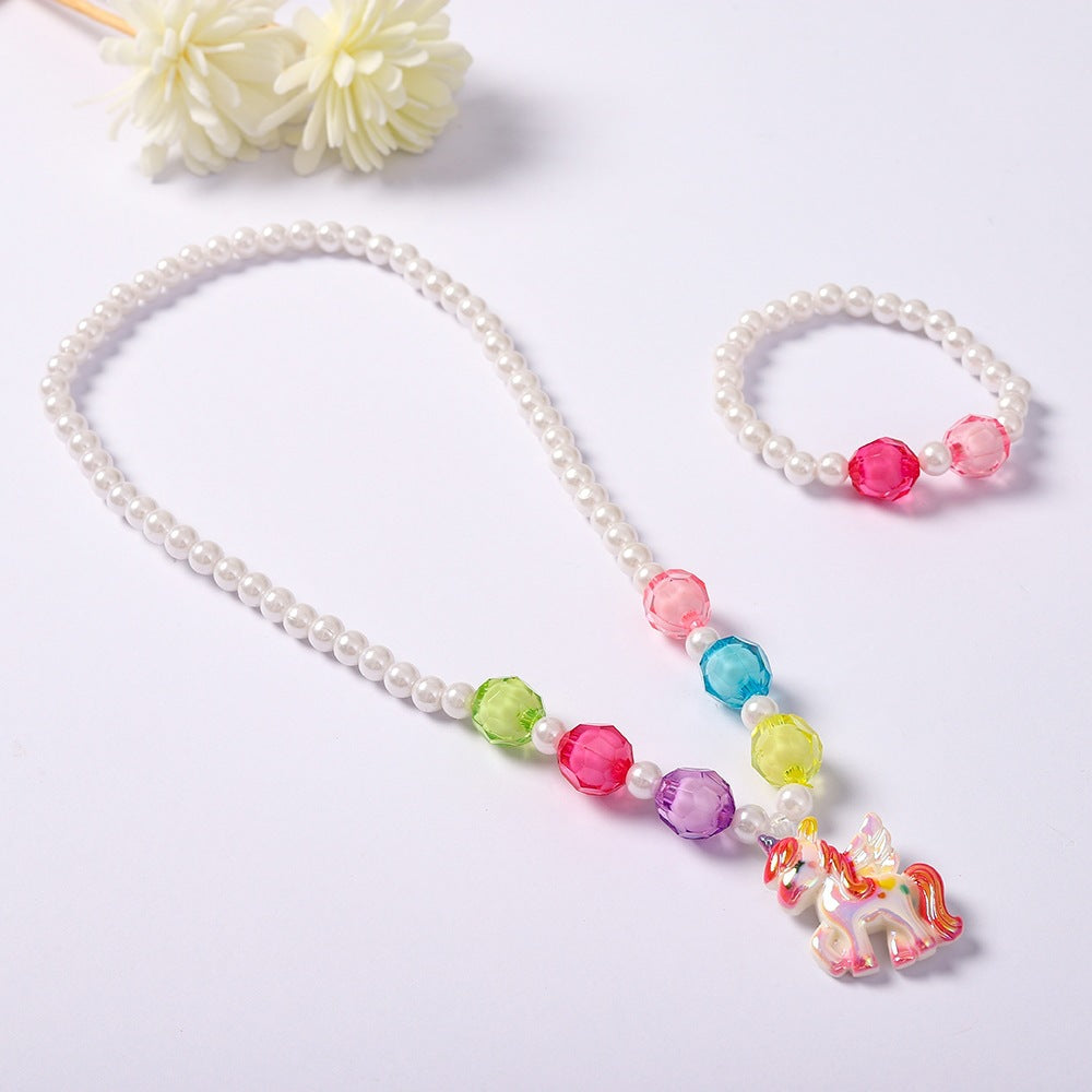 Brightly colored unicorn necklace and bracelet set, designed to delight girls with its magical, playful style.