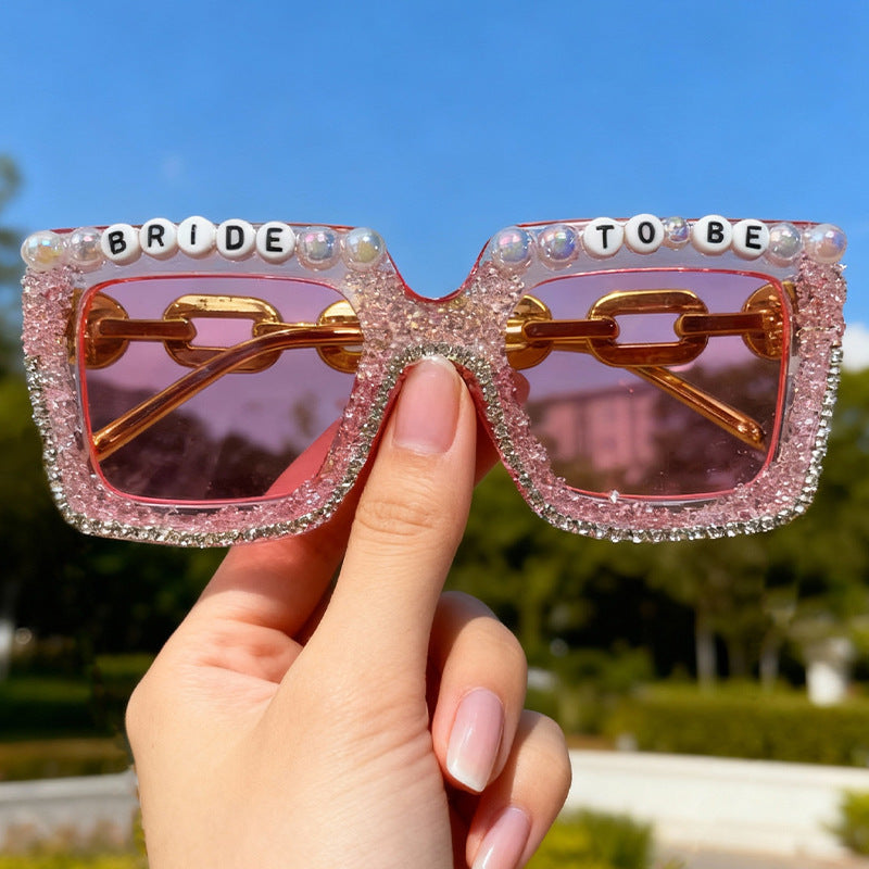 Chic women's bridal theme sunglasses with pearls, rhinestones, & UV protection, great for outdoor celebrations.
