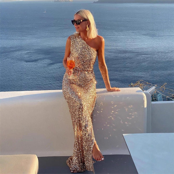 Elegant women's one-shoulder champagne maxi dress. Sleek formal evening gown with a flattering side slit design.