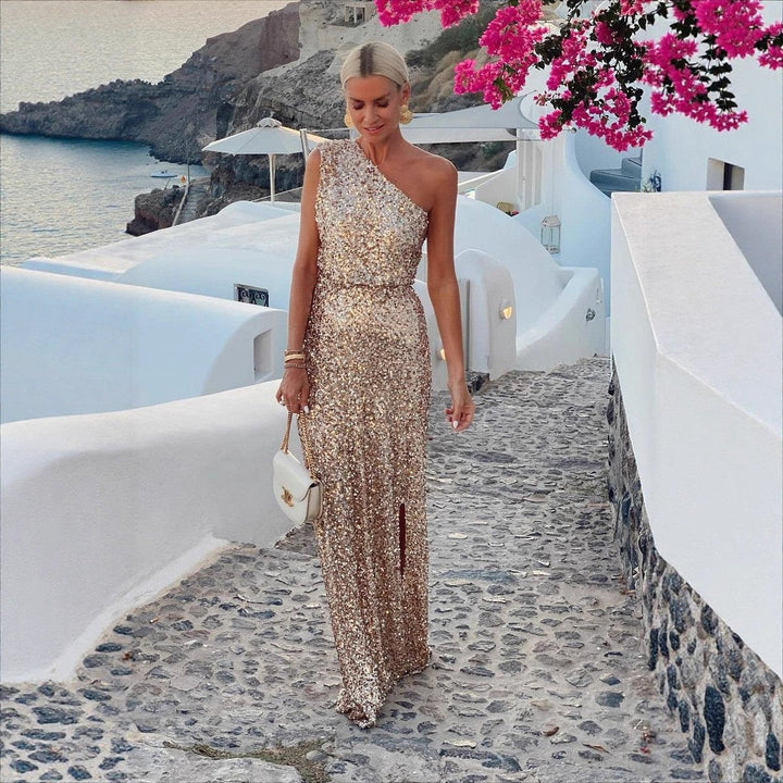 Champagne one-shoulder maxi cocktail dress for women. Formal evening gown with a stylish high side slit.