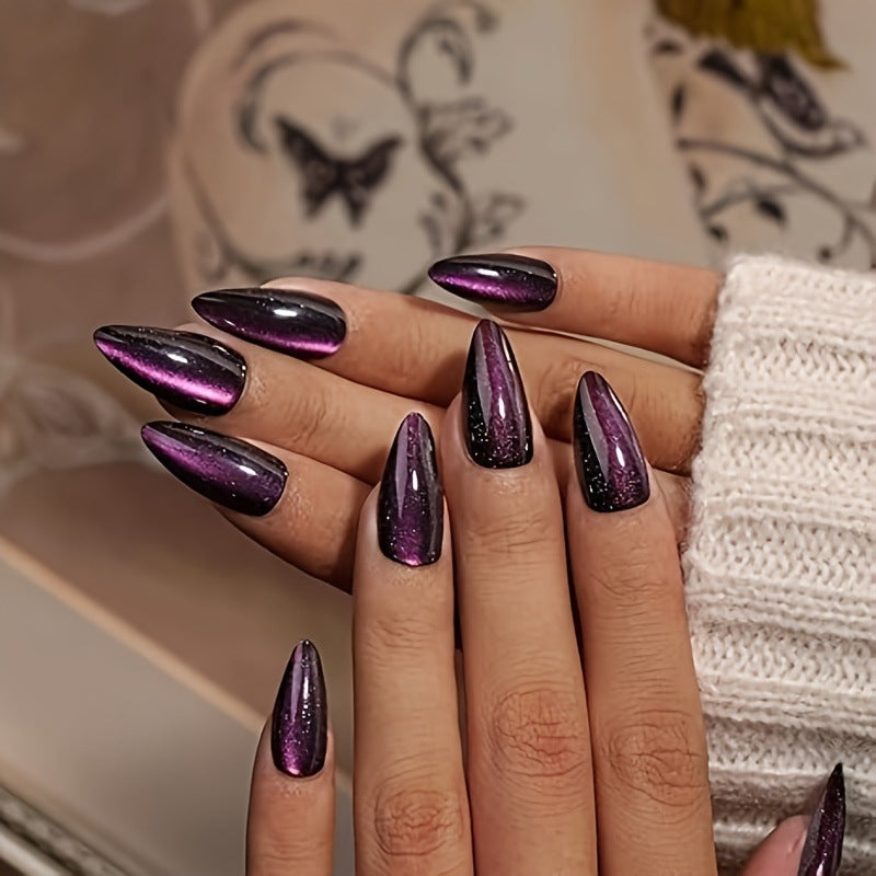 Glamorous purple glitter stiletto press-on nails for women. Easy application false nails for a stunning manicure.