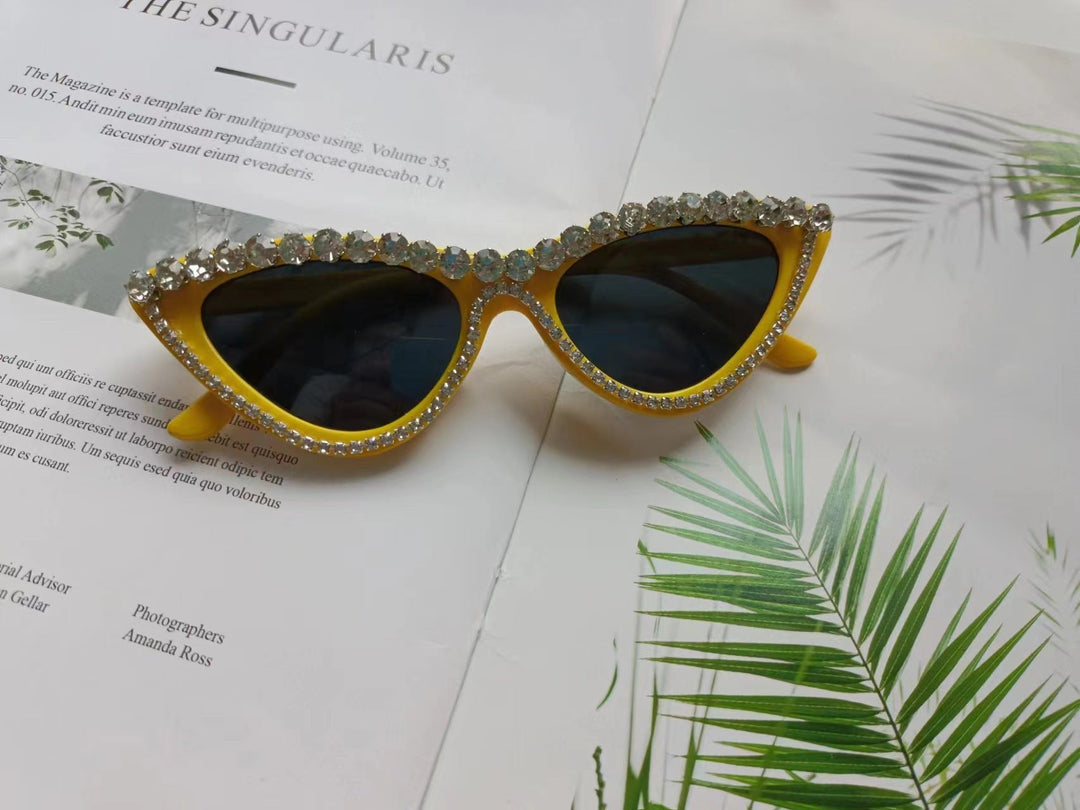 Rhinestone cat-eye sunglasses for women. Glamorous, vintage style eyewear offering essential UV protection.