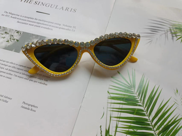 Rhinestone cat-eye sunglasses for women. Glamorous, vintage style eyewear offering essential UV protection.