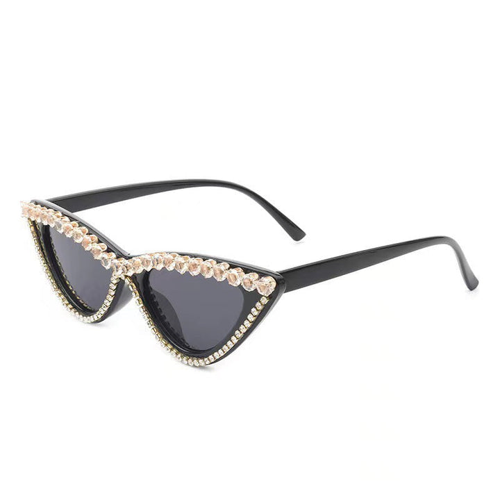 Women's vintage style cat-eye sunglasses, adorned with rhinestones. Perfect for summer glamour & UV protection.