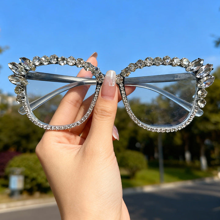 Product shot: Women's sparkling cat-eye sunglasses, glamorous rhinestone eyewear for fashion and UV protection.