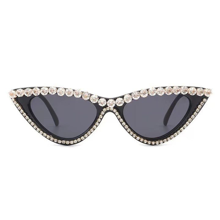 Vintage-inspired cat-eye sunglasses for women, featuring rhinestones. Glamorous accessory with UV protection.