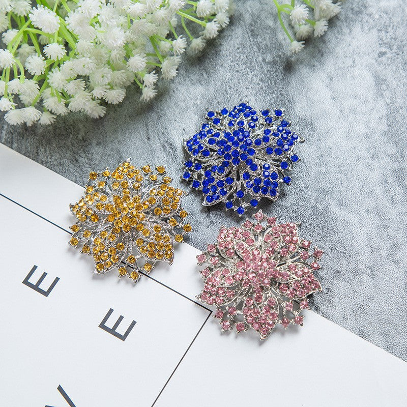 Elegant floral crystal brooch pin for women, a sparkling jewelry accessory for dresses and blazers.