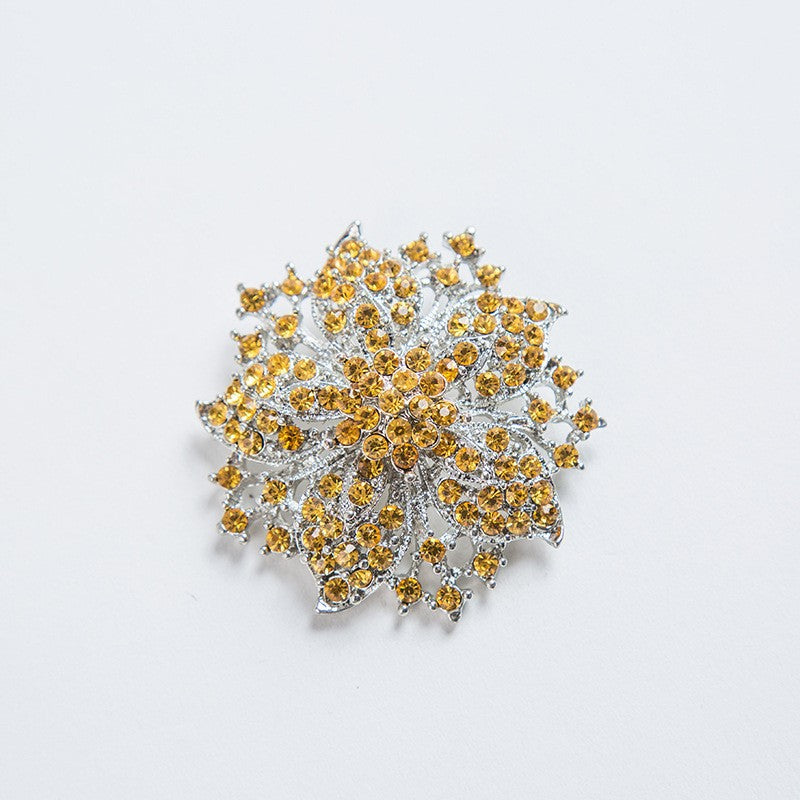 Sparkling women's crystal floral brooch pin, ideal for formal wear, scarves, or evening bags.
