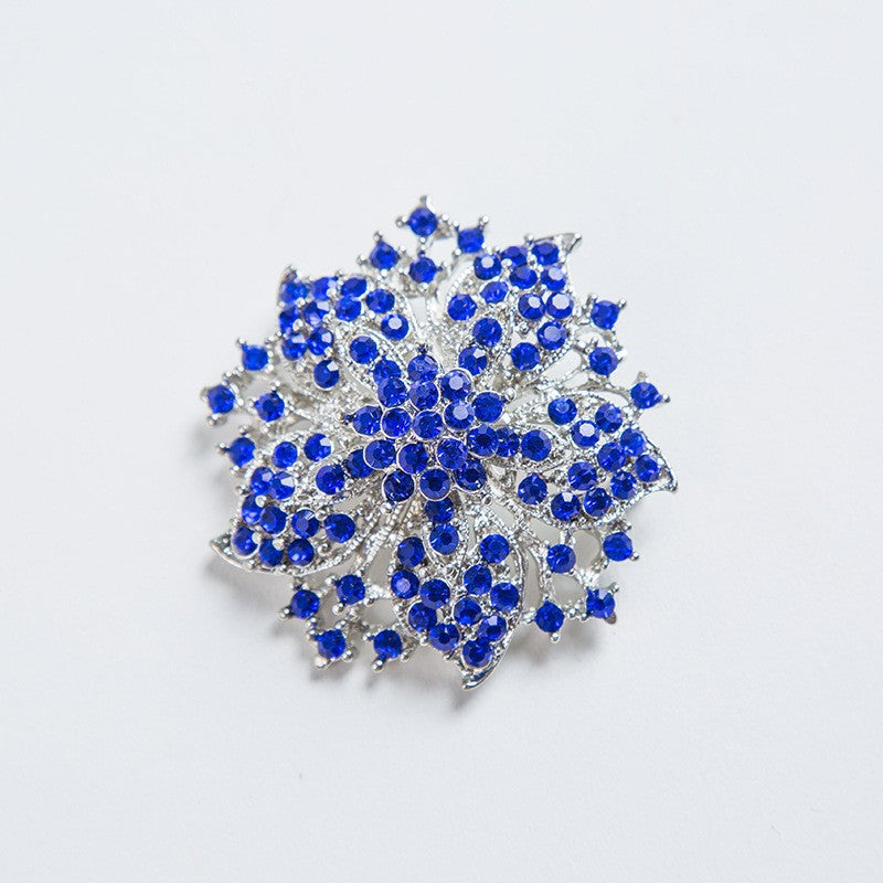 Vibrant crystal brooch for women's fashion, an elegant pin accessory that makes a statement.