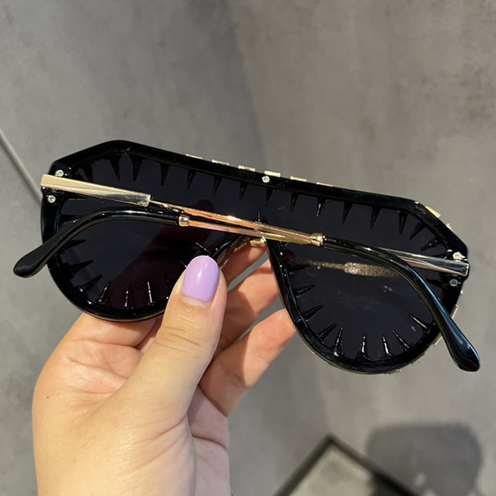 Statement women's cat-eye sunglasses with sparkling glitter & rhinestones. Fashionable UV protection eye wear.