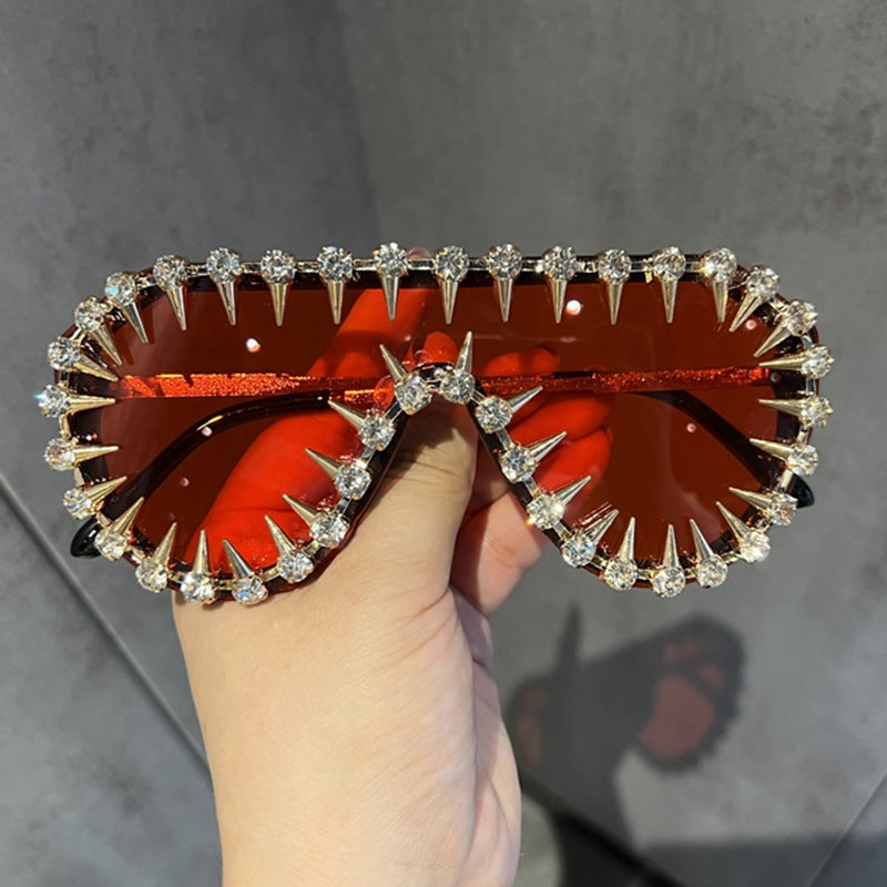 Women's fashionable cat-eye sunglasses, sparkling with glitter & rhinestones. Glamorous eye wear offering UV protection.