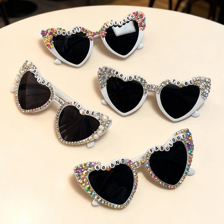 Chic women's heart-shaped bridal sunglasses with UV protection & rhinestone accents.