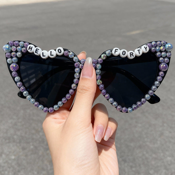 UV protected women's heart sunglasses, a glamorous bridal accessory ideal for bachelorette celebrations.