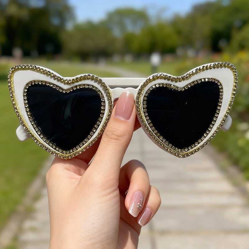 Perfect summer accessory: Women's heart-frame rhinestone sunglasses. Trendy, chic, and provides UV protection.