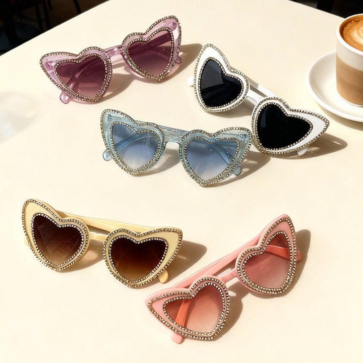 Chic women's heart frame rhinestone sunglasses. Stylish eyewear for summer, offering UV protection.