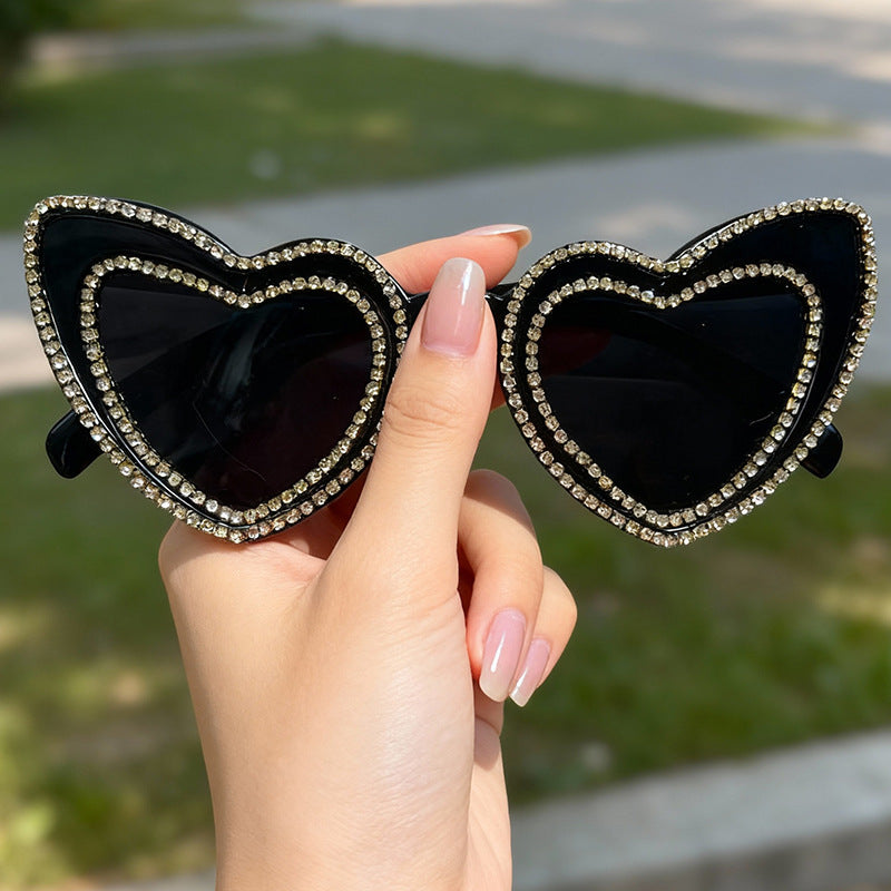 Women's fashion heart frame sunglasses. Rhinestone accents, UV protection, perfect trendy summer accessory.