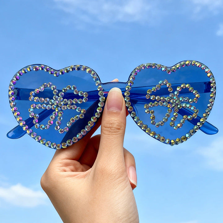 Glamorous women's heart-shaped rhinestone sunglasses with sparkling UV protection.
