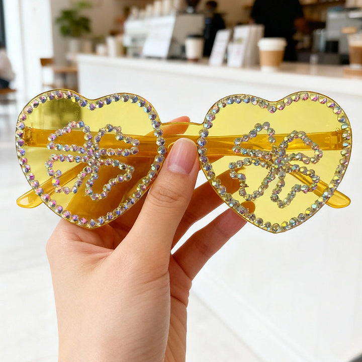 Elegant women's heart-shaped eyewear, adorned with glamorous rhinestones.