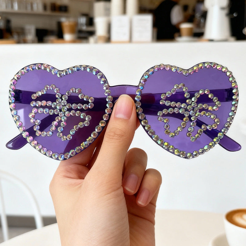 Stylish women's heart sunglasses, encrusted with shimmering rhinestones.