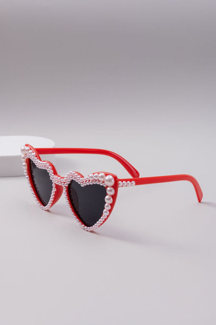 Luxurious heart-shaped women's sunglasses, glamorous and trendy eyewear offering full UV protection.
