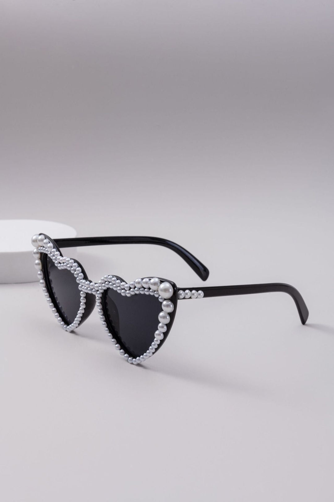 Stylish heart-shaped women's sunglasses, glamorous eyewear with a modern twist for any outfit.