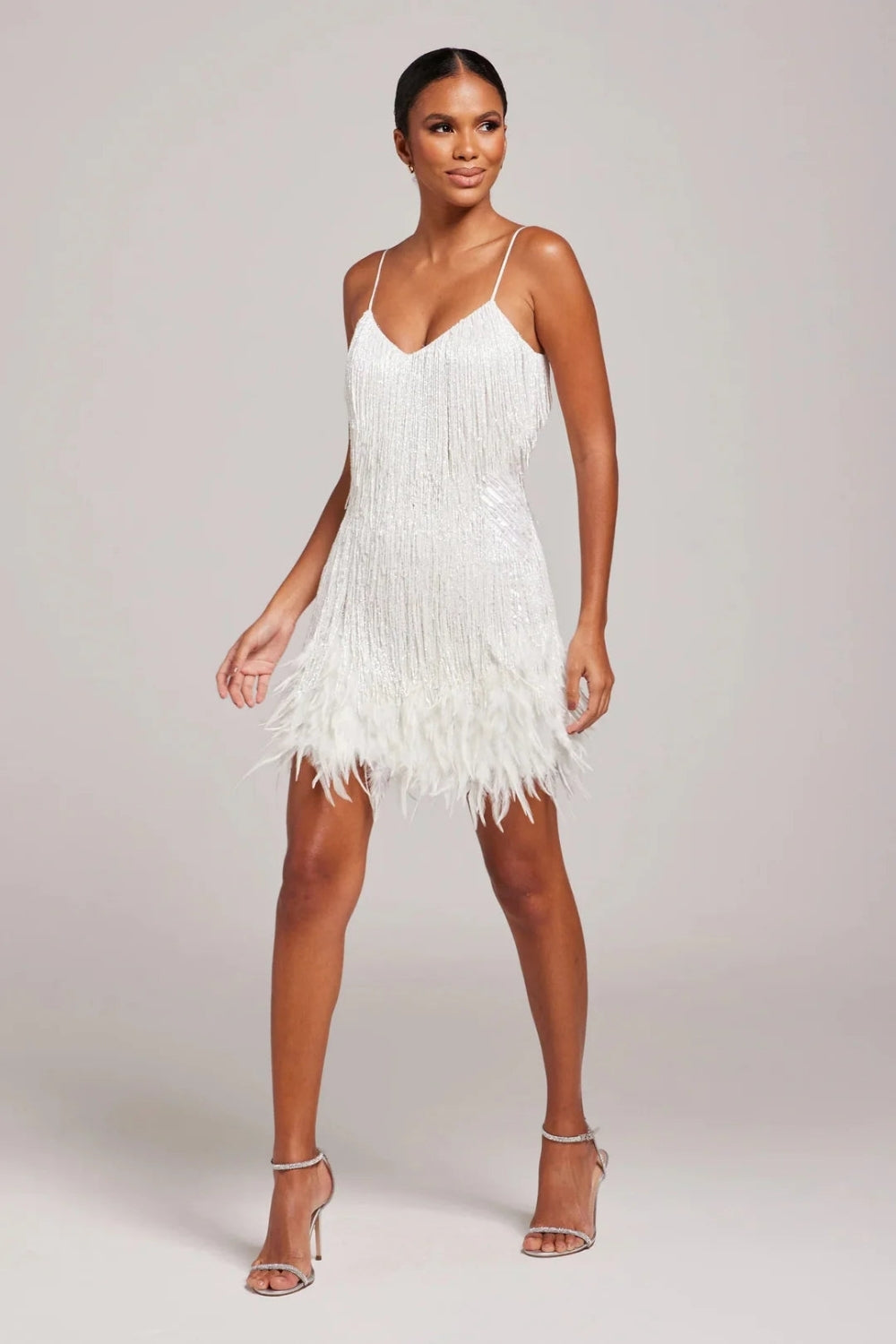 Stunning V-neck spaghetti strap mini dress for women, featuring elegant fringe and feather embellishments.