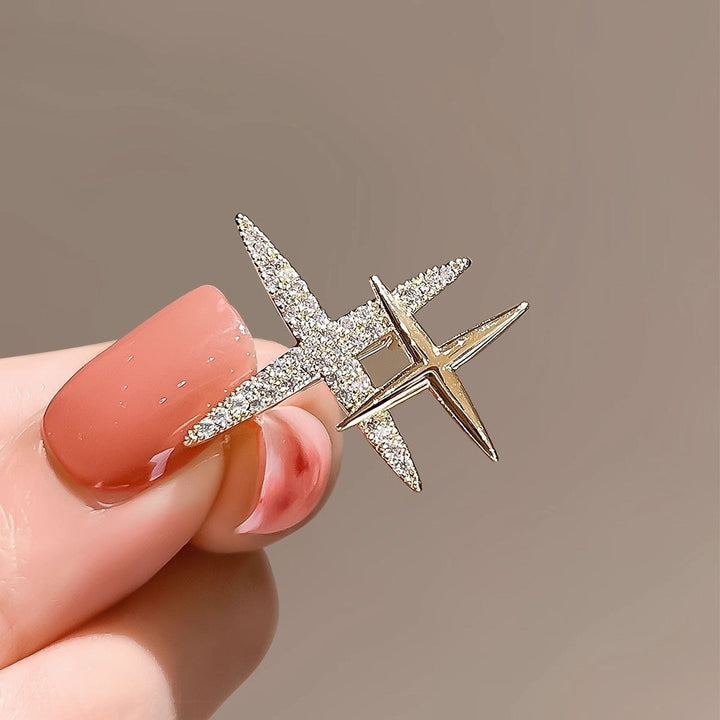 Close-up of a sparkling rhinestone brooch, an elegant women's jewelry pin with shimmering crystals.