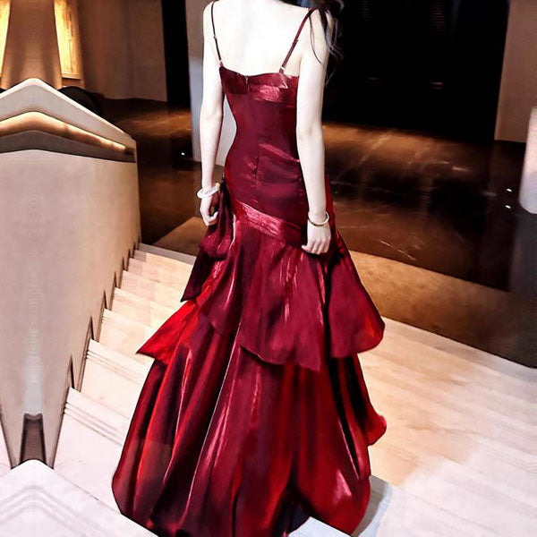 Flowing glamorous women's ruffled maxi dress, an elegant choice for special occasion, long evening wear.