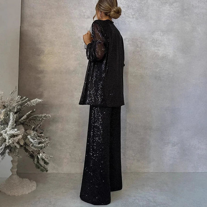 Chic women's sequin two-piece set with a shimmering top and flattering high-waisted pants for statement fashion.